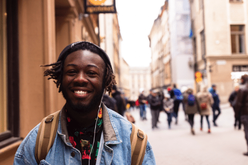 Team Man in street smiling