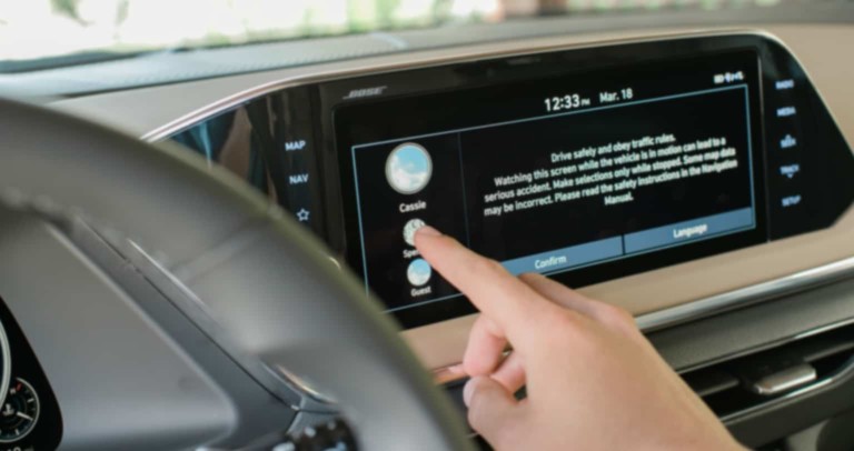 A person scrolling through an ECU in a car