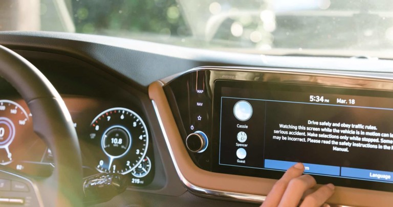 A person scrolling through an ECU in a car