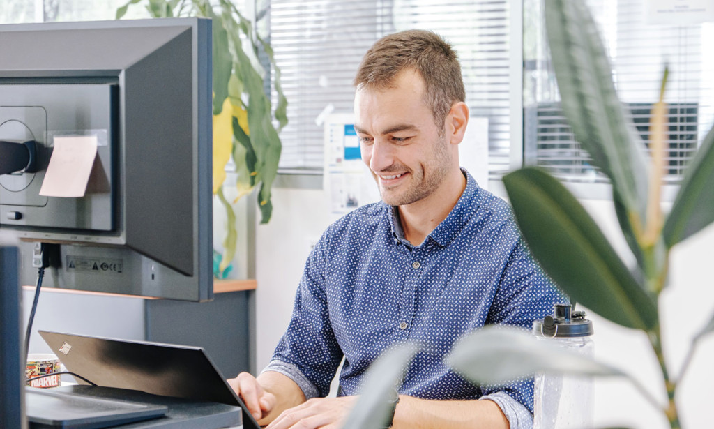 About us man at laptop