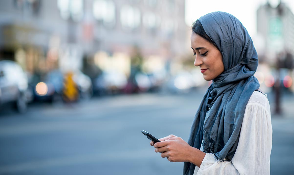 app-security-1 Lady using smartphone in street