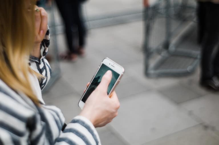 A woman looking at her mobile phone