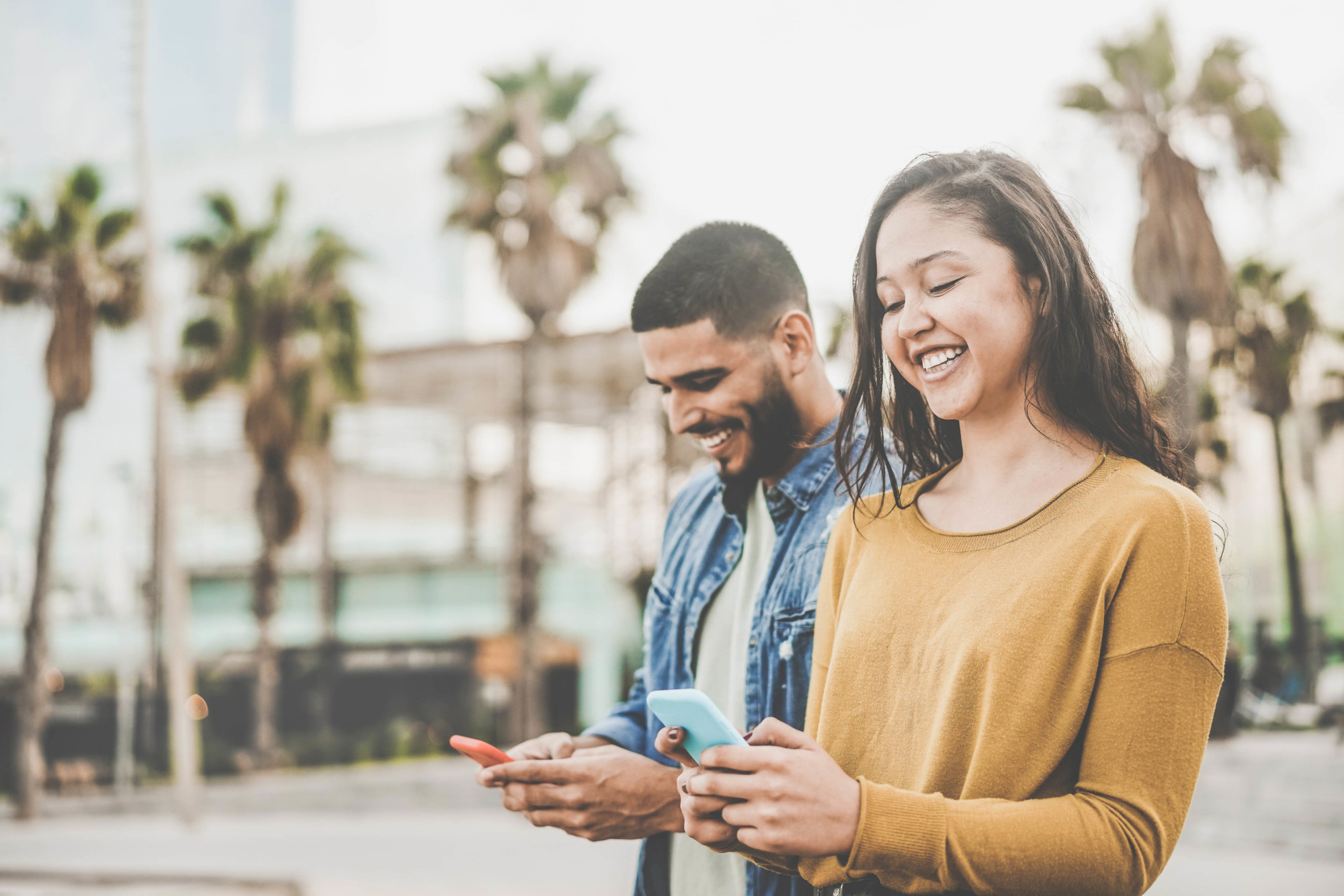 Latin,Couple,Shopping,Online,Using,Smartphone,App,-,Young,People