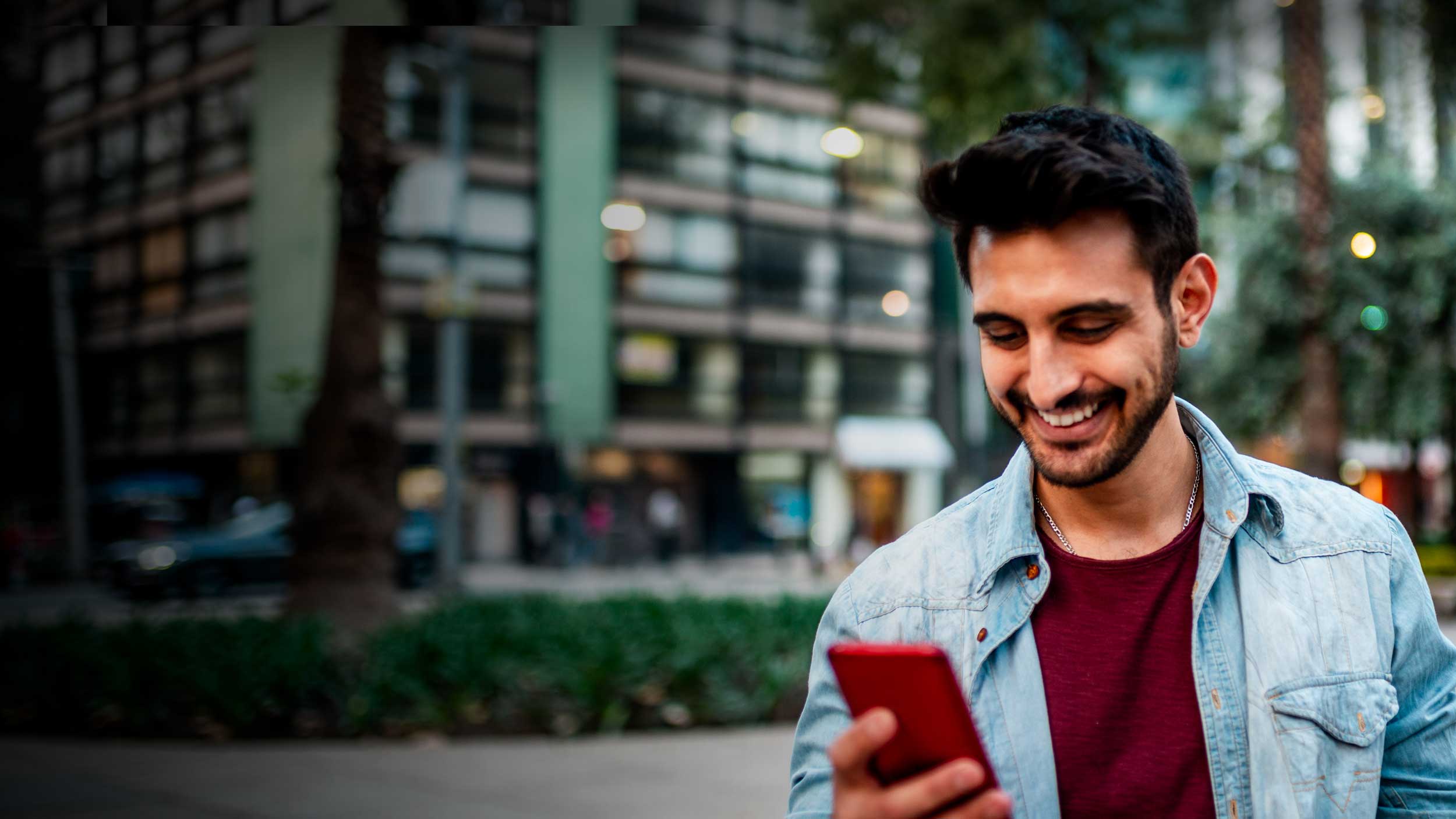 Man scrolling on mobile phone