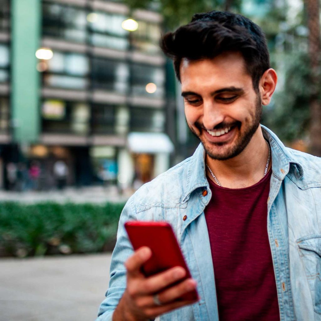 Man scrolling on mobile phone